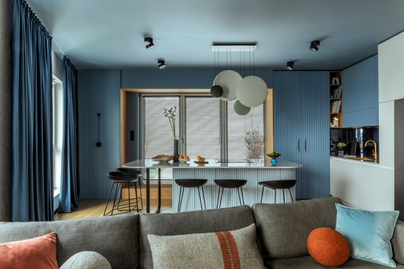 modern interior with blue walls and white kitchen island